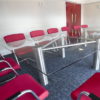 Glass Boardroom Tables with Red Chairs