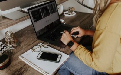 lady working from living room table | makeshift home office