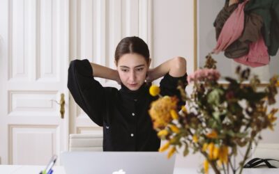 Lady with back pain working from home